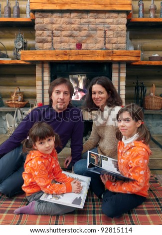 Children Reading Books With Parents