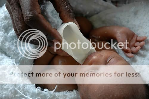 Feeding Baby Milk From A Cup