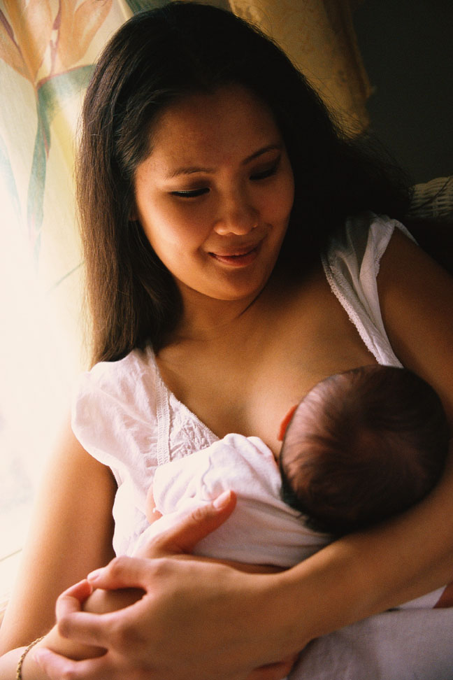 Mother Feeding Baby Milk