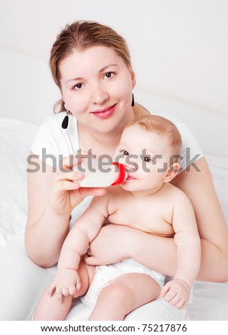 Mother Feeding Baby Milk